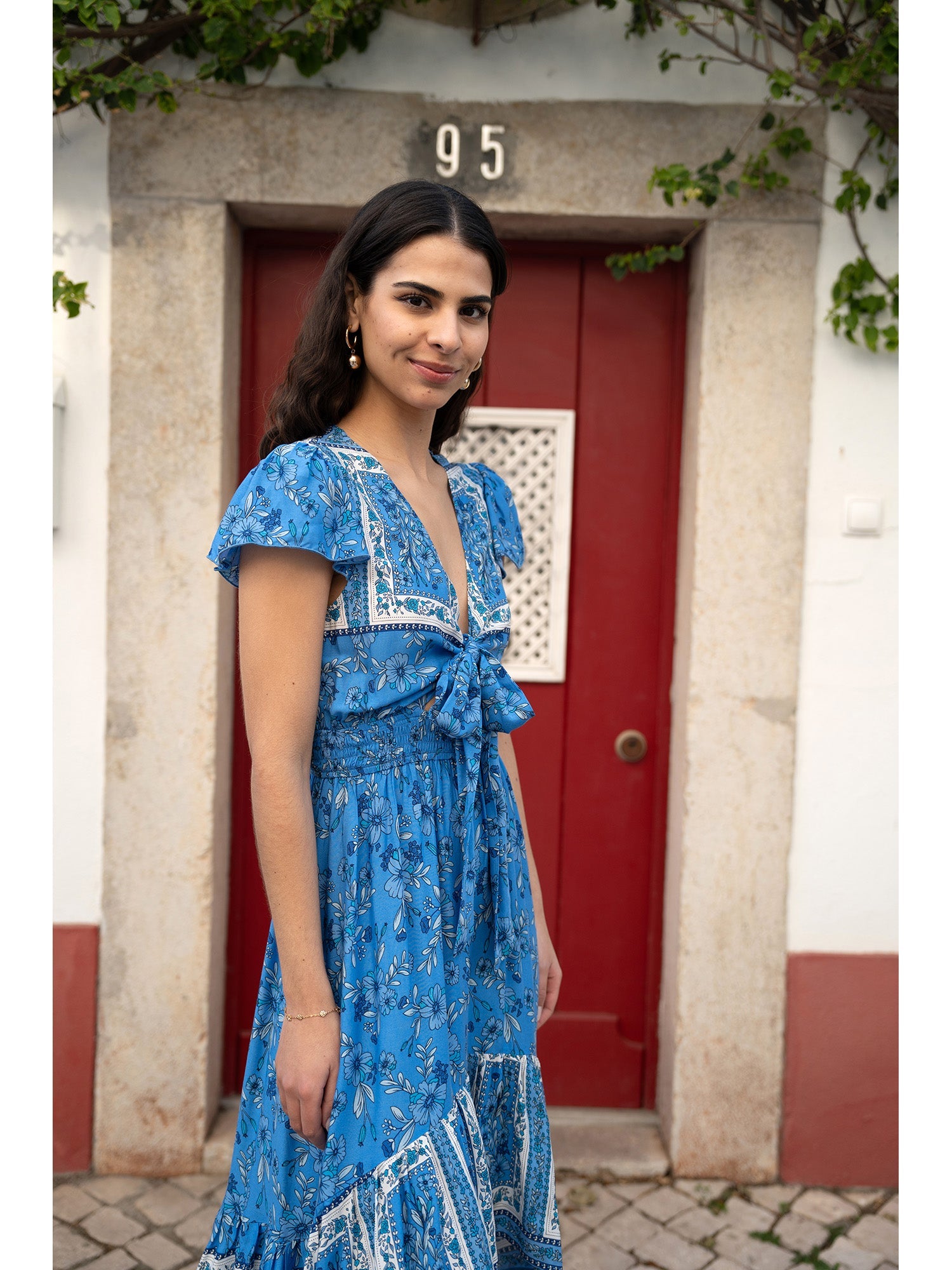 Mela Blue Ditsy Print Sun Dress With Cross Over Back Tie Front And Dip Hem