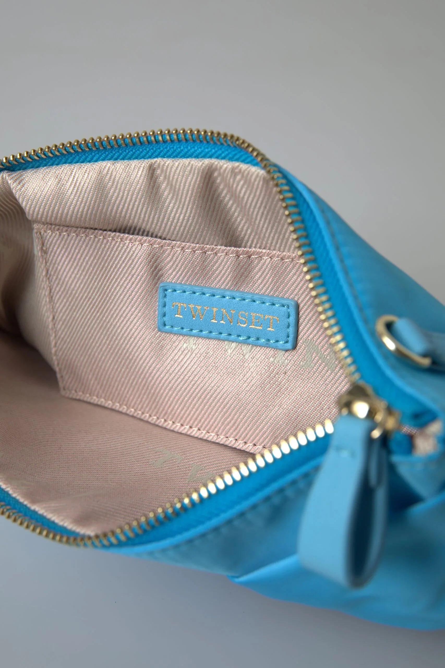 Twinset Clutch aus blauer Taftseide mit großer Schleife und Reißverschluss, Damentasche mit Borse-Logo