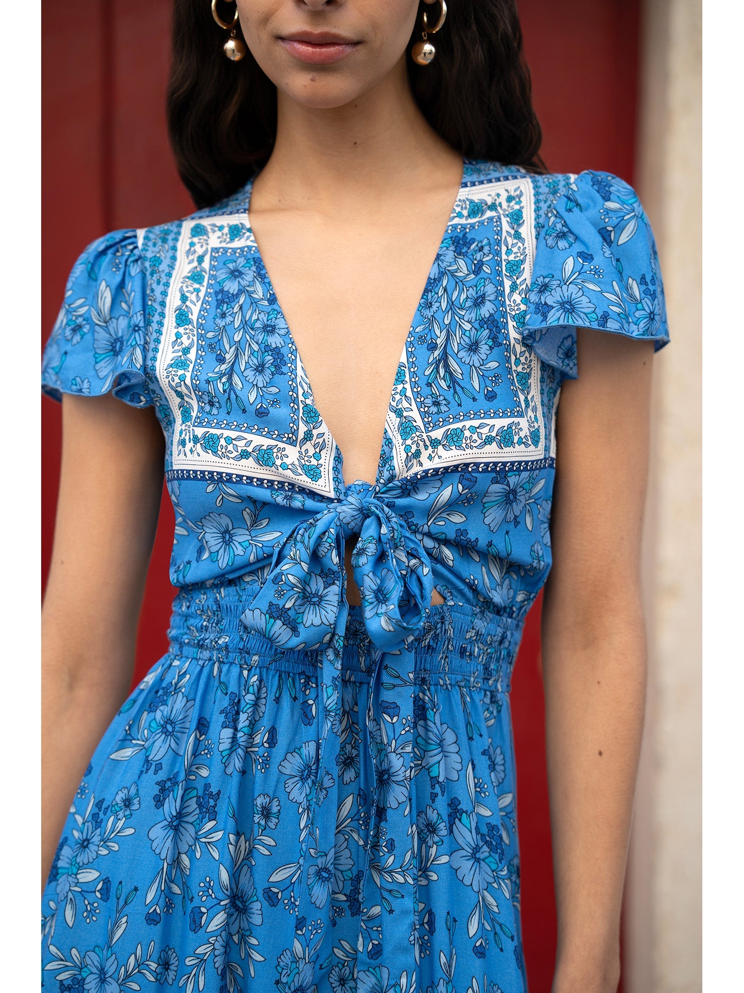 Mela Blue Ditsy Print Sun Dress With Cross Over Back Tie Front And Dip Hem